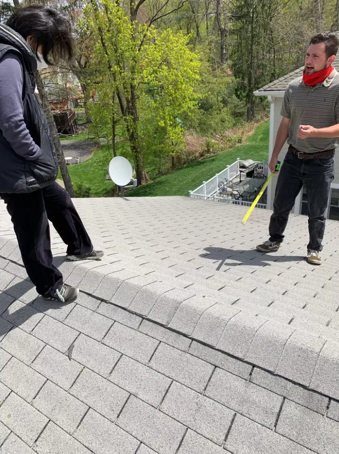 Employees Working On New Roof
